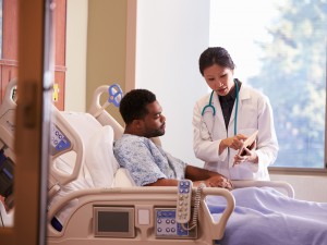 Doctor talking to patient in hospital
