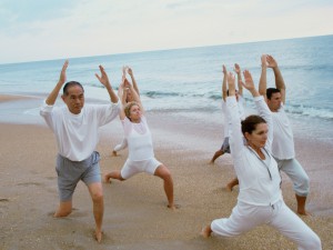 Group exercising on the beach