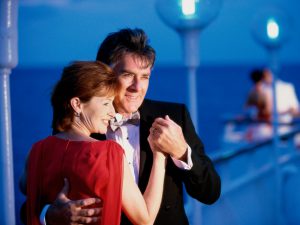 Mature couple dancing on the deck of a cruise ship