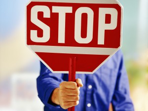 Man holding stop sign