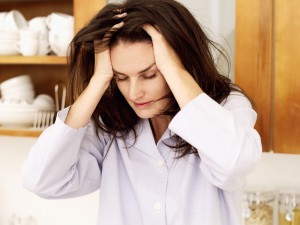 Young woman with hands on her head