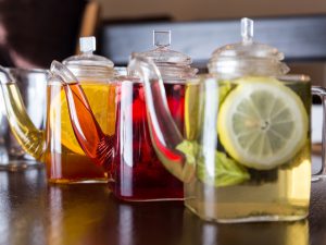 Three square teapots with different fruit tastes of tea