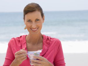 Woman eating yogurt