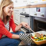 Woman baking vegetables