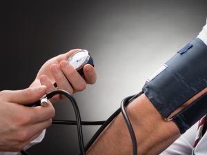 Doctor Checking Blood Pressure Of A Patient