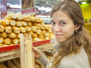 Woman buying bread