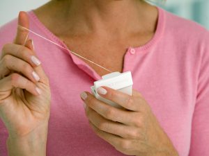 Woman holding floss