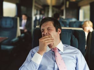 Tired man on train