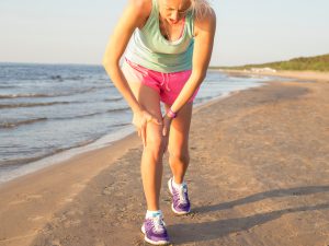 Woman with muscle spasm