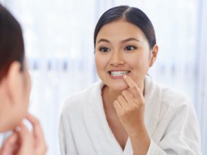 Woman looking at teeth