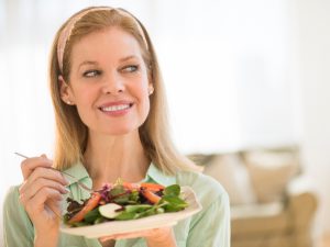 Mature woman with basket of produce