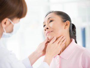 Woman at doctor for thyroid