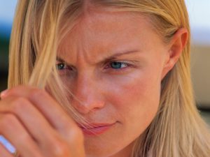 Woman looking at hair