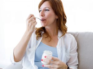 Woman eating yogurt