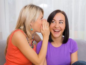 Women telling secrets