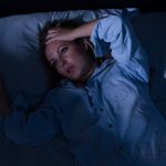 Woman with poor sleep habits