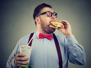 Man eating junk food