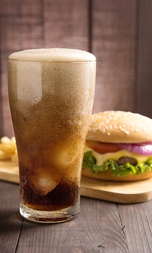 Fast food cola and cheeseburger