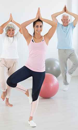 Yoga instructor and senior group