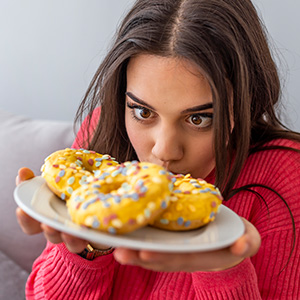 Woman looking at sugary foods
