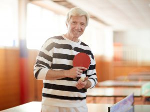 Senior man playing ping pong